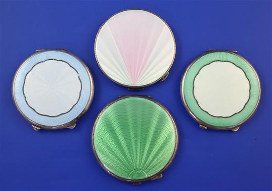 Two 1920s and two 1930s Art Deco engine turned silver and guilloche enamel circular compacts, 2.75in et infra.